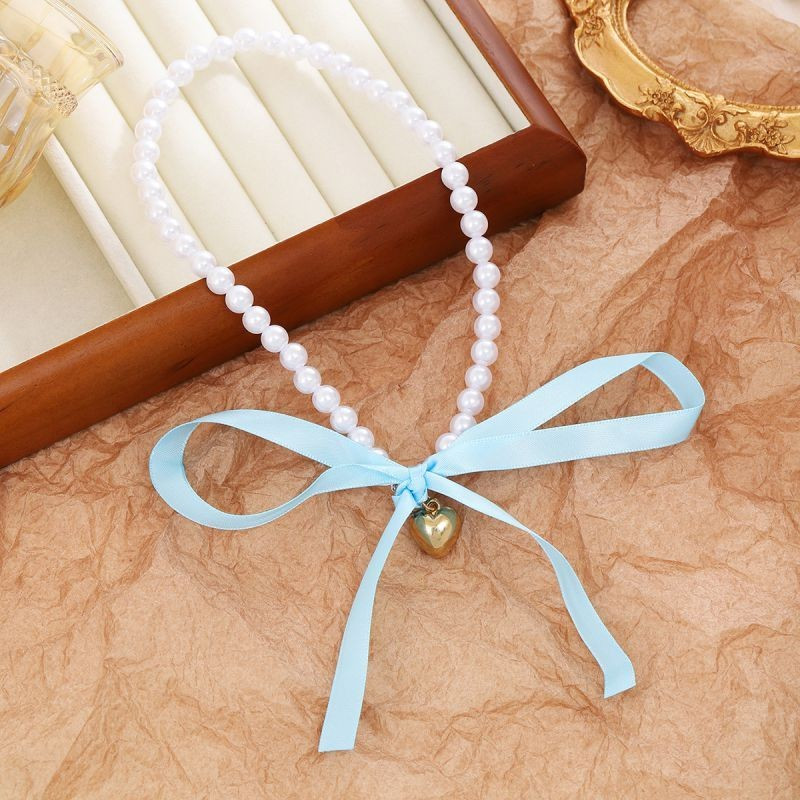 Деликатные бусы из жемчуга с текстильным бантом CJG39568