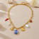 Золотистая массивная цепь с морскими подвесками и синей жемчужиной CJP55849
