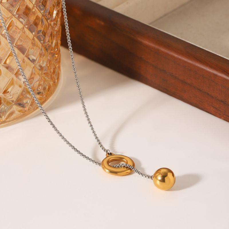 Золотистое колье-галстук с кольцом и сферой CJL78824 Золотистое колье-галстук с кольцом и сферой CJL78824