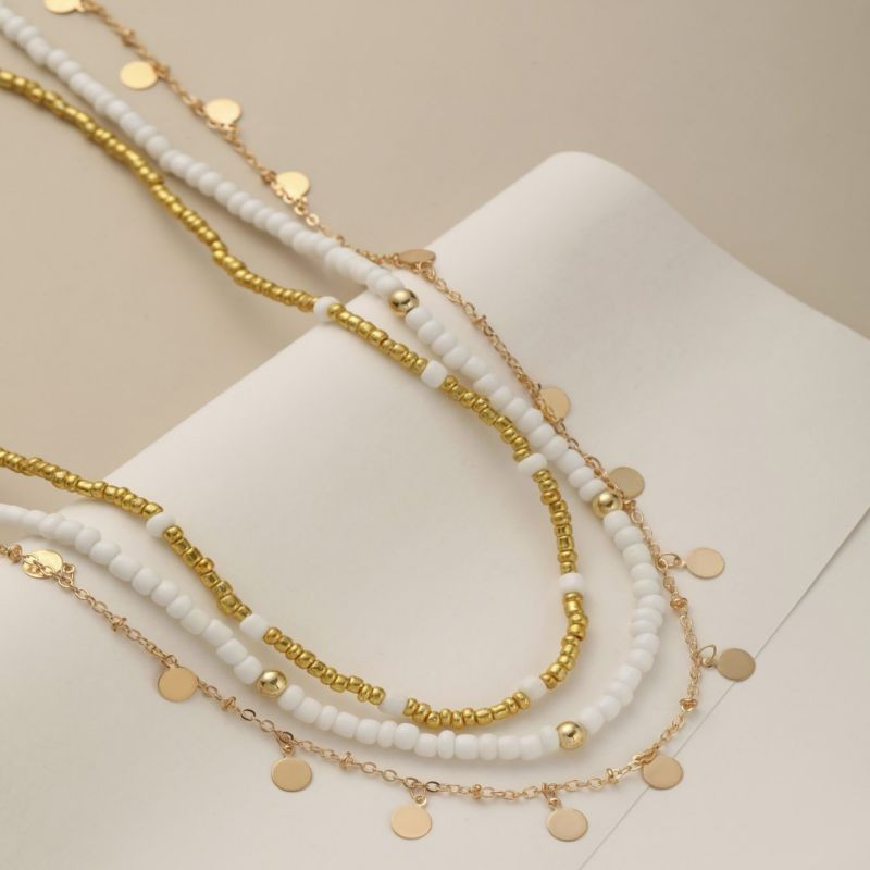 Многослойное колье с россыпью золотистых дисков CJG34590