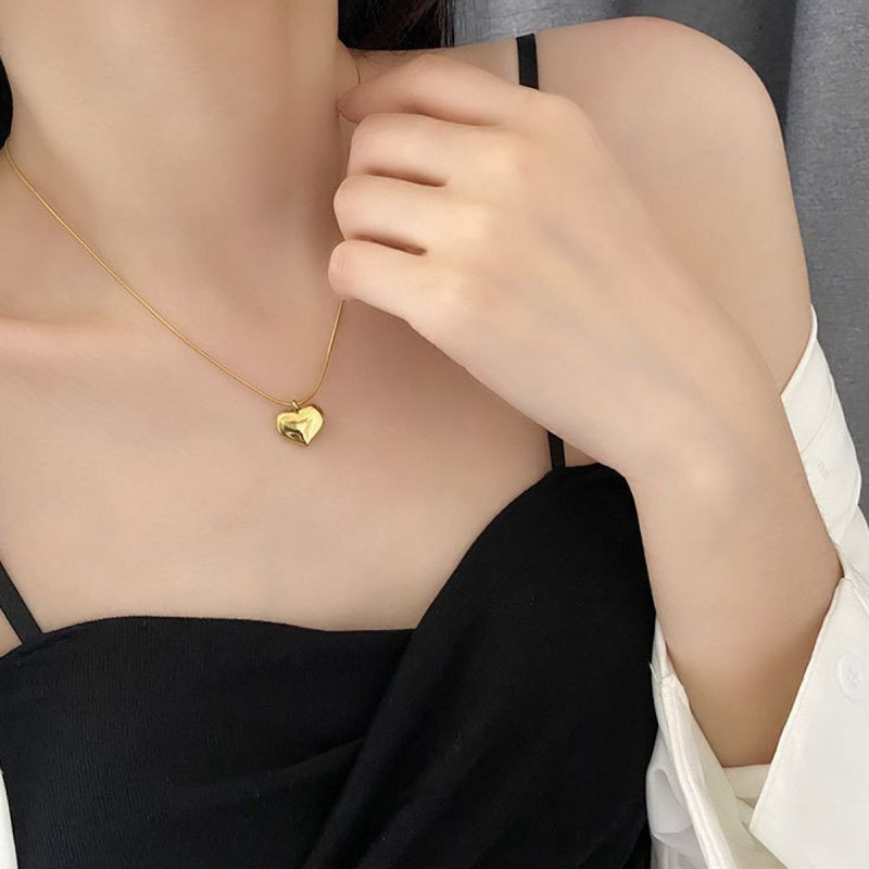 Серебристое колье с сердцем и цепочкой в виде сердца CJX69894