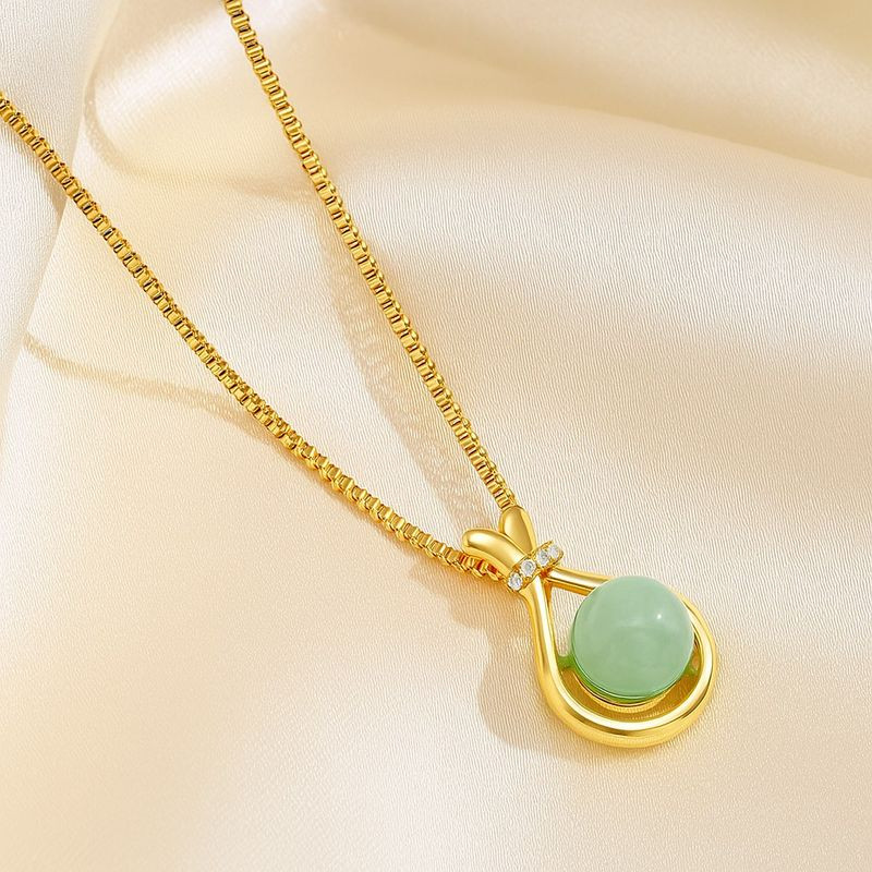 Колье с шарообразной вставкой из камня в золотой оправе J10818CJJ