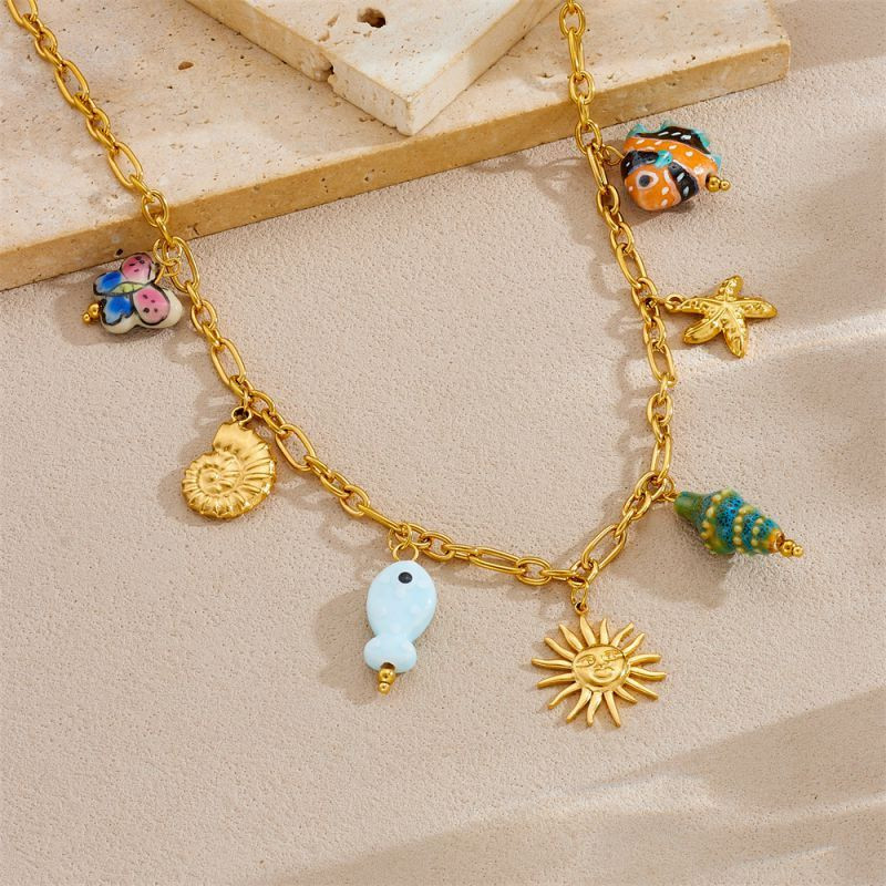 Золотистая многослойная цепь с морскими и небесными символами CJP55865 Золотистая многослойная цепь с морскими и небесными символами CJP55865