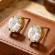 Золотистые серьги с шестью бриллиантами из титановой стали CJX74515
