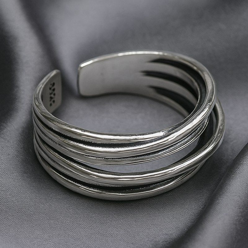 Многослойное кольцо из тонких серебристых нитей 1J12180CJJ