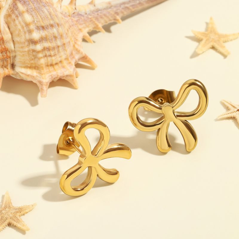 Серьги-гвоздики бантики медь напыление золотом 1J12406CJJ