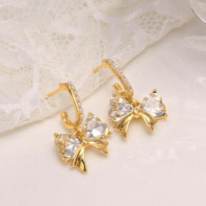 Золотистые нарядные серьги с бантами и крупными кристаллами CJH34985 Золотистые нарядные серьги с бантами и крупными кристаллами CJH34985