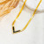 Золотистое колье "змейка" с черной V-образной вставкой CJJ10528